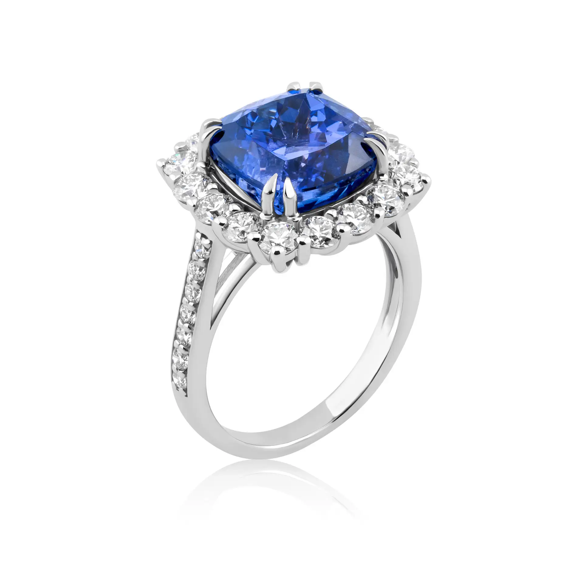 An evening cocktail tanzanite ring with a rich blue-violet tanzanutei n a square cushion cut surrounded by a halo of duamonds
